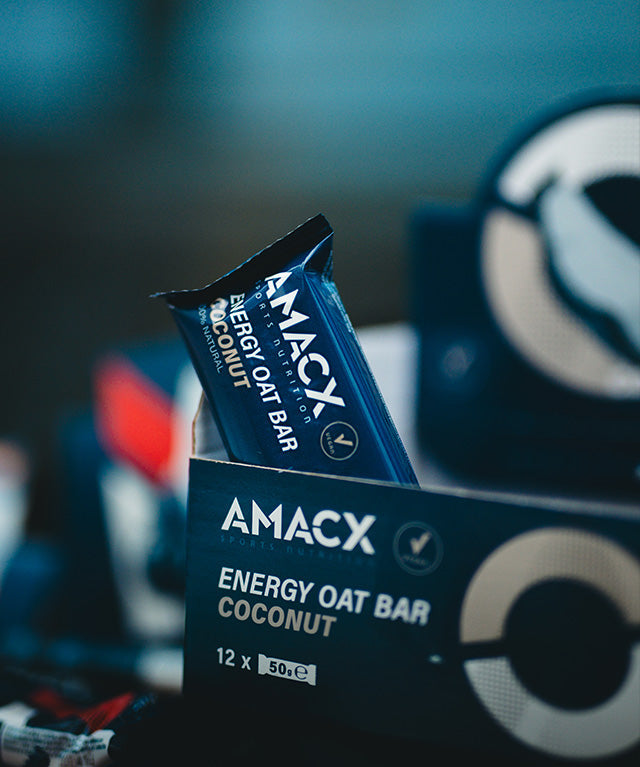 Energy Oat Bar Coconut | 12 pack showing a single bar partially out of the box in portrait orientation, gallery 5