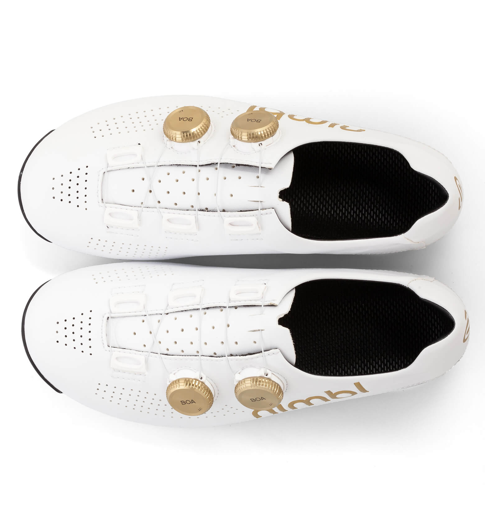 Top view of white Nimbl ULTIMATE cycling shoes with gold dials and perforated uppers on white background