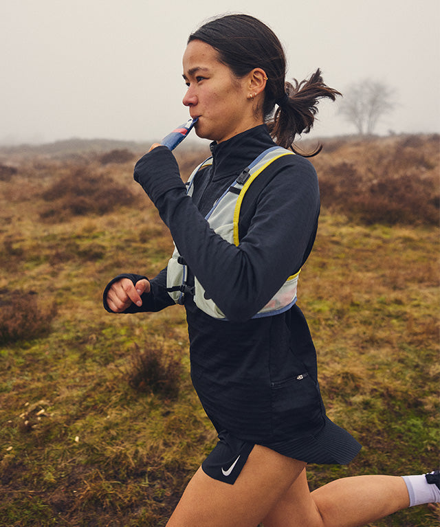 Woman running outdoors while consuming Drink Gel Strawberry | 12-pack in portrait gallery position 6 shot
