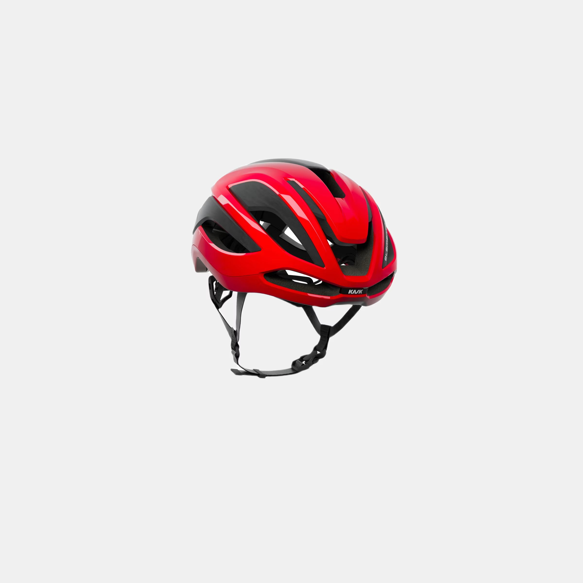 Kask Elemento Helmet - Red shown front side with aerodynamic vents and adjustable chin straps against white background