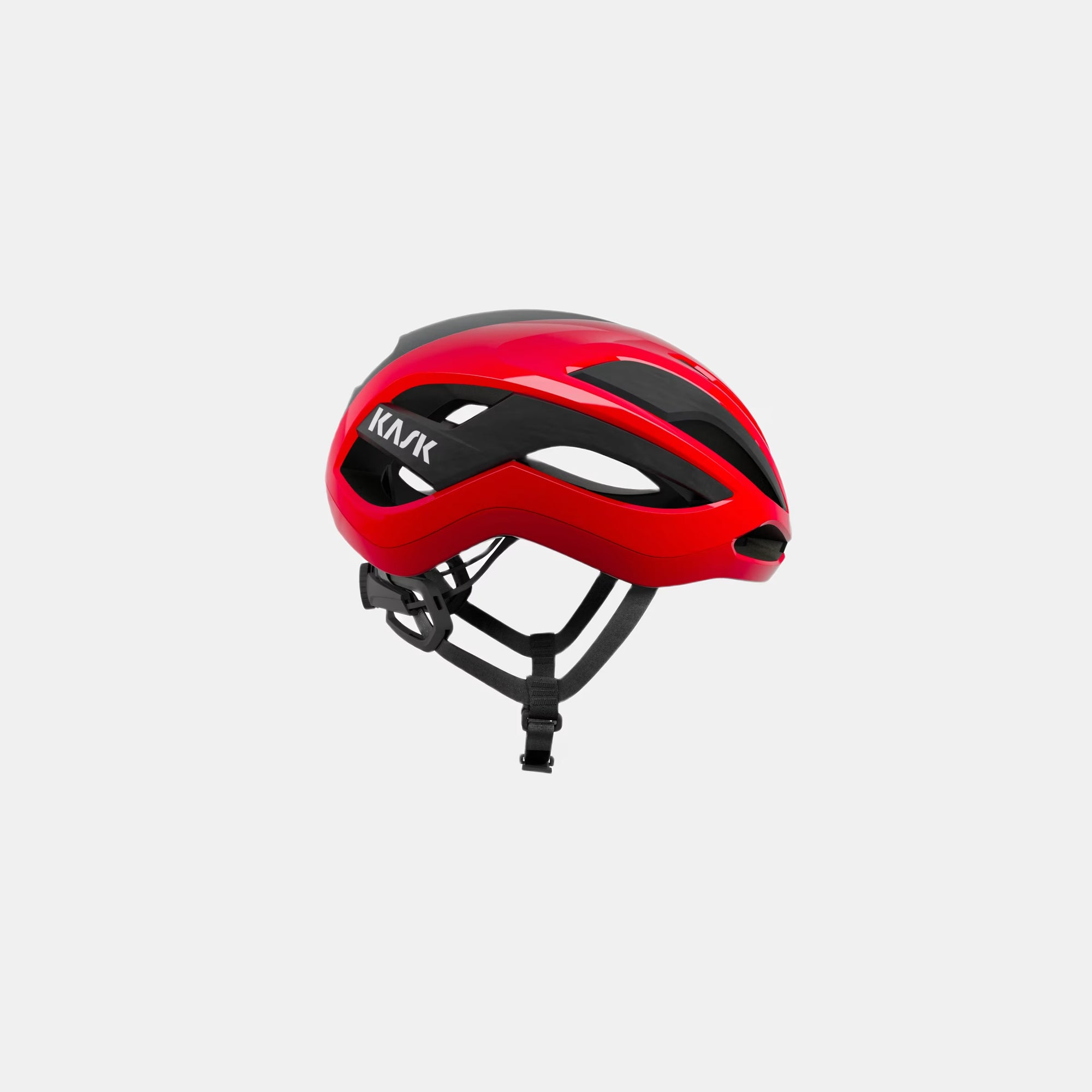 Kask Elemento Helmet - Red side view showing aerodynamic design and adjustable black straps for road cycling safety and comfort