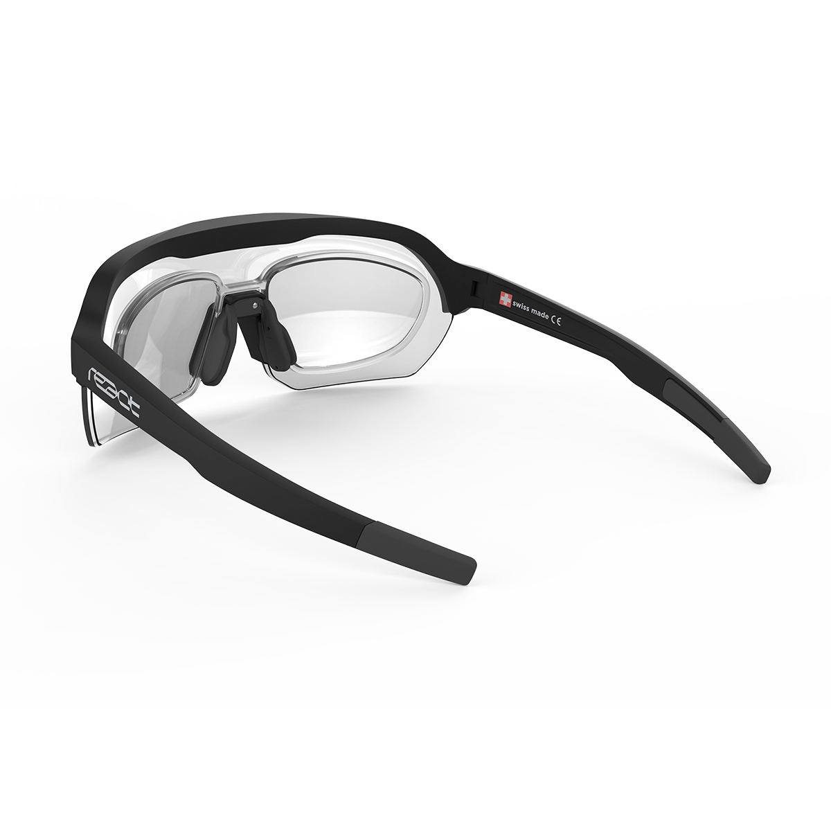 REACT Correction Clip for Optray shown attached to black frame sunglasses with clear prescription lenses