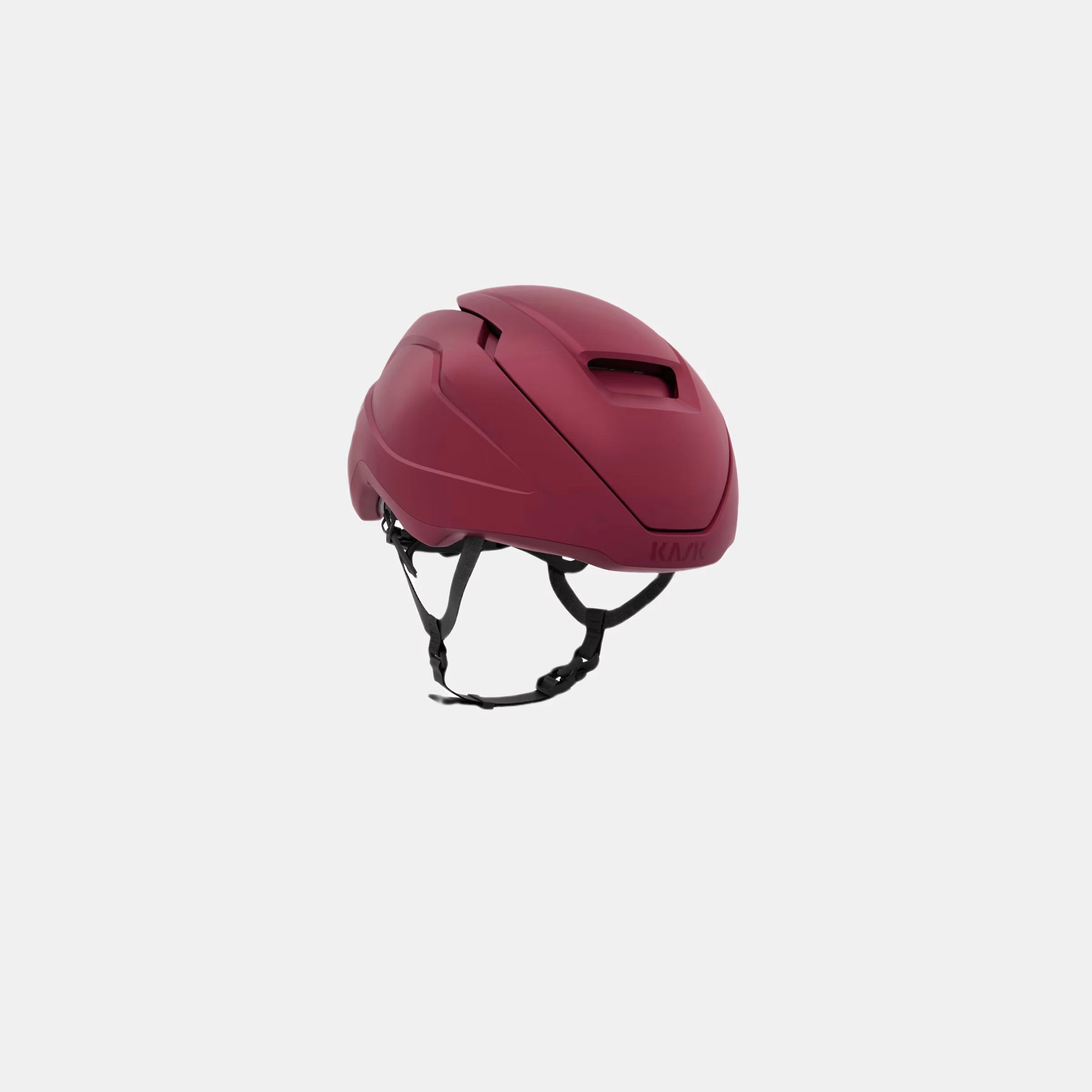 Kask Wasabi Helmet - Burgundy Matt shown angled with adjustable vent and secure black straps against white background