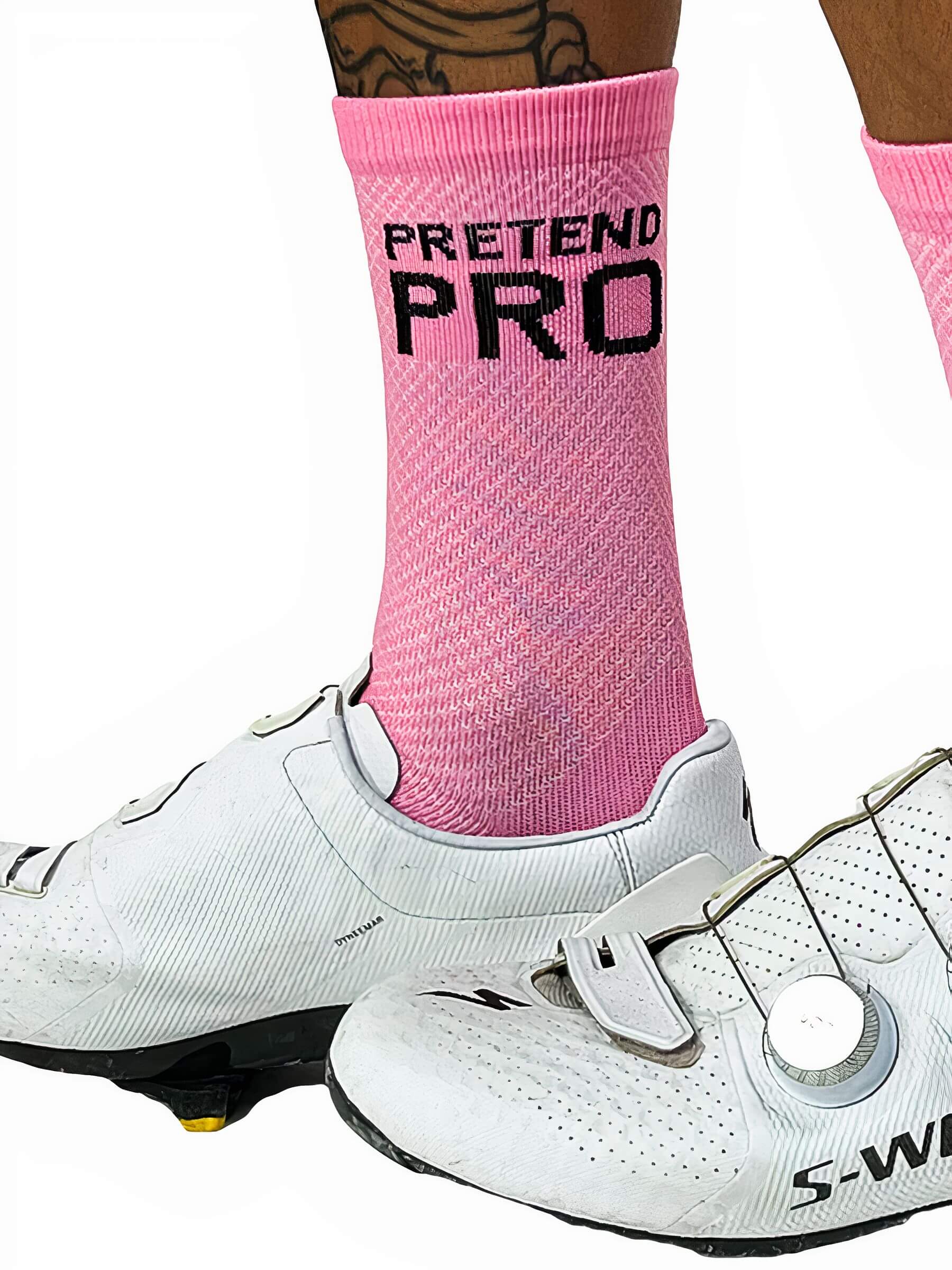 Close-up of feet wearing Ostroy Pretend Pro Pink Socks with white cycling shoes against white background