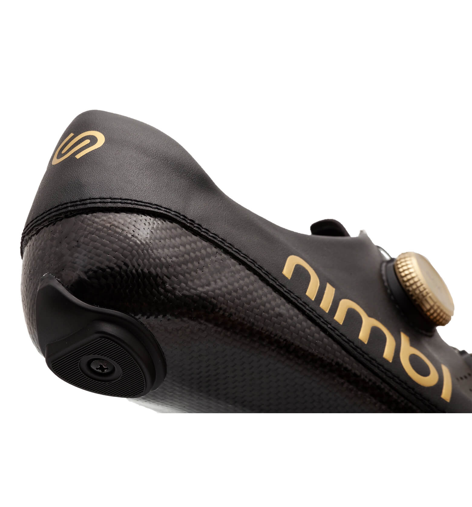 Close-up of Nimbl ULTIMATE cycling shoe showing sleek black design and gold accents on heel and fastening dial