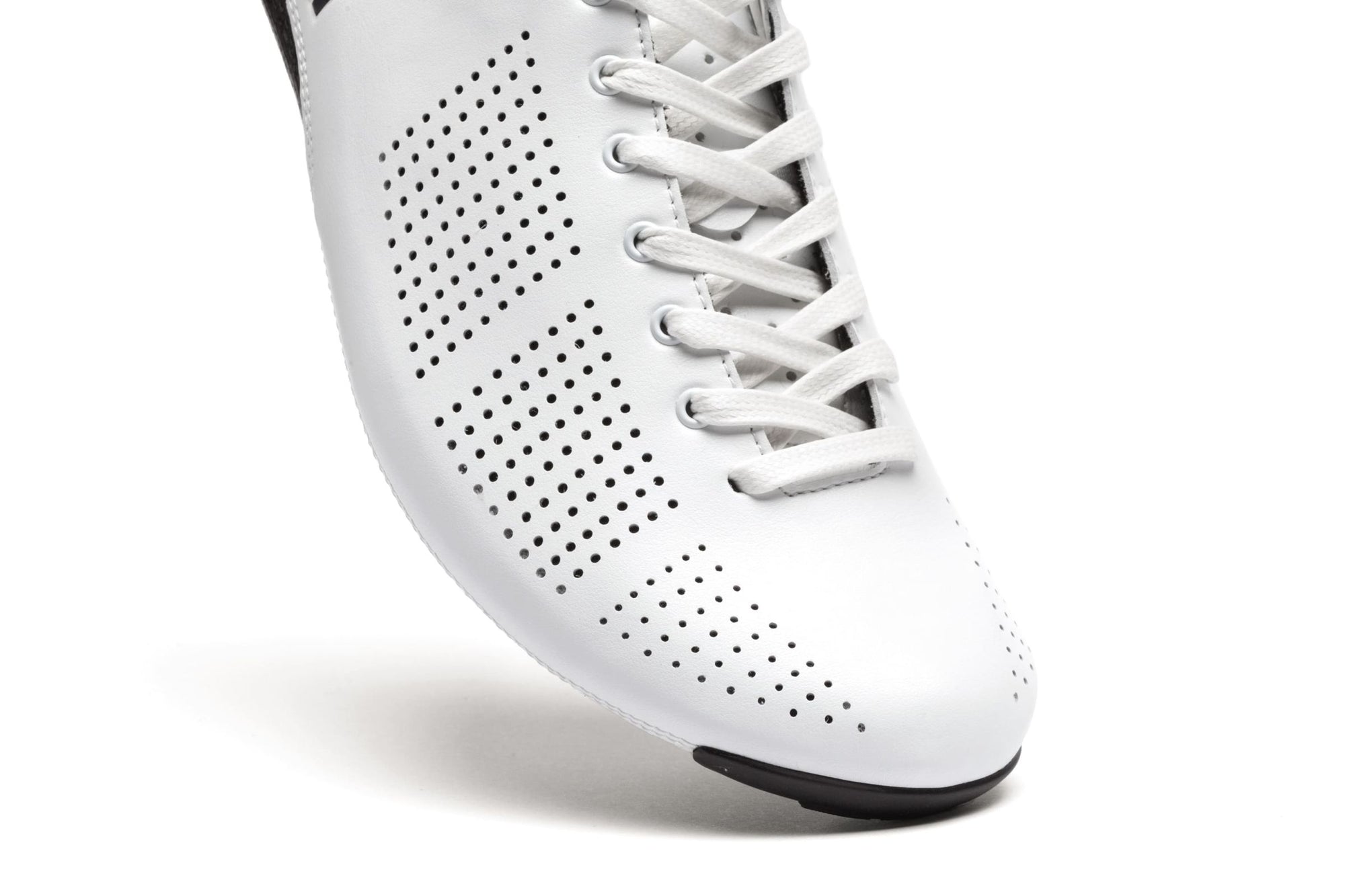 Close-up of the Nimbl AIR climber's shoe showing white perforated upper and lace-up design for breathability and fit