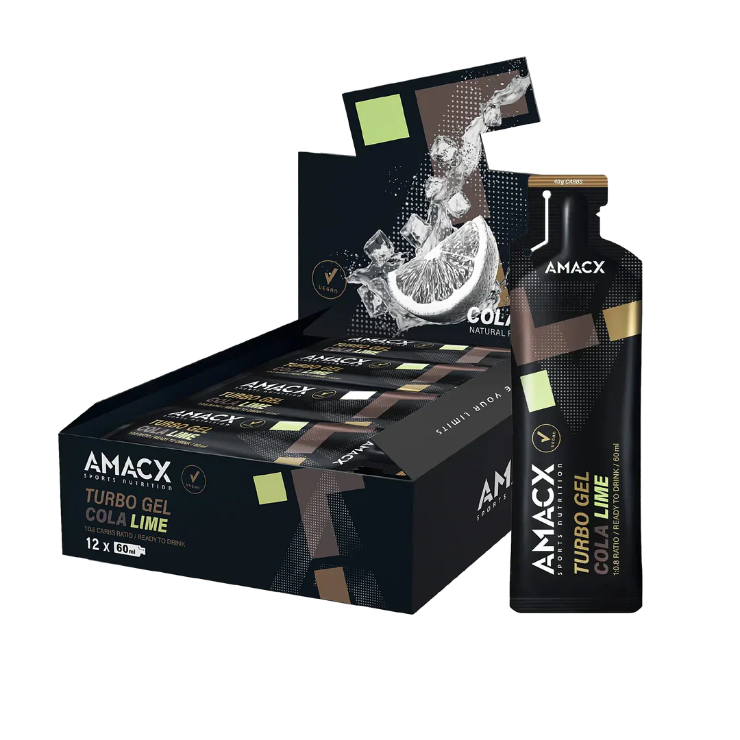 Box and sachets of Amacx Turbo Gel Cola Lime energy gel with a lemon wedge and ice splash background.