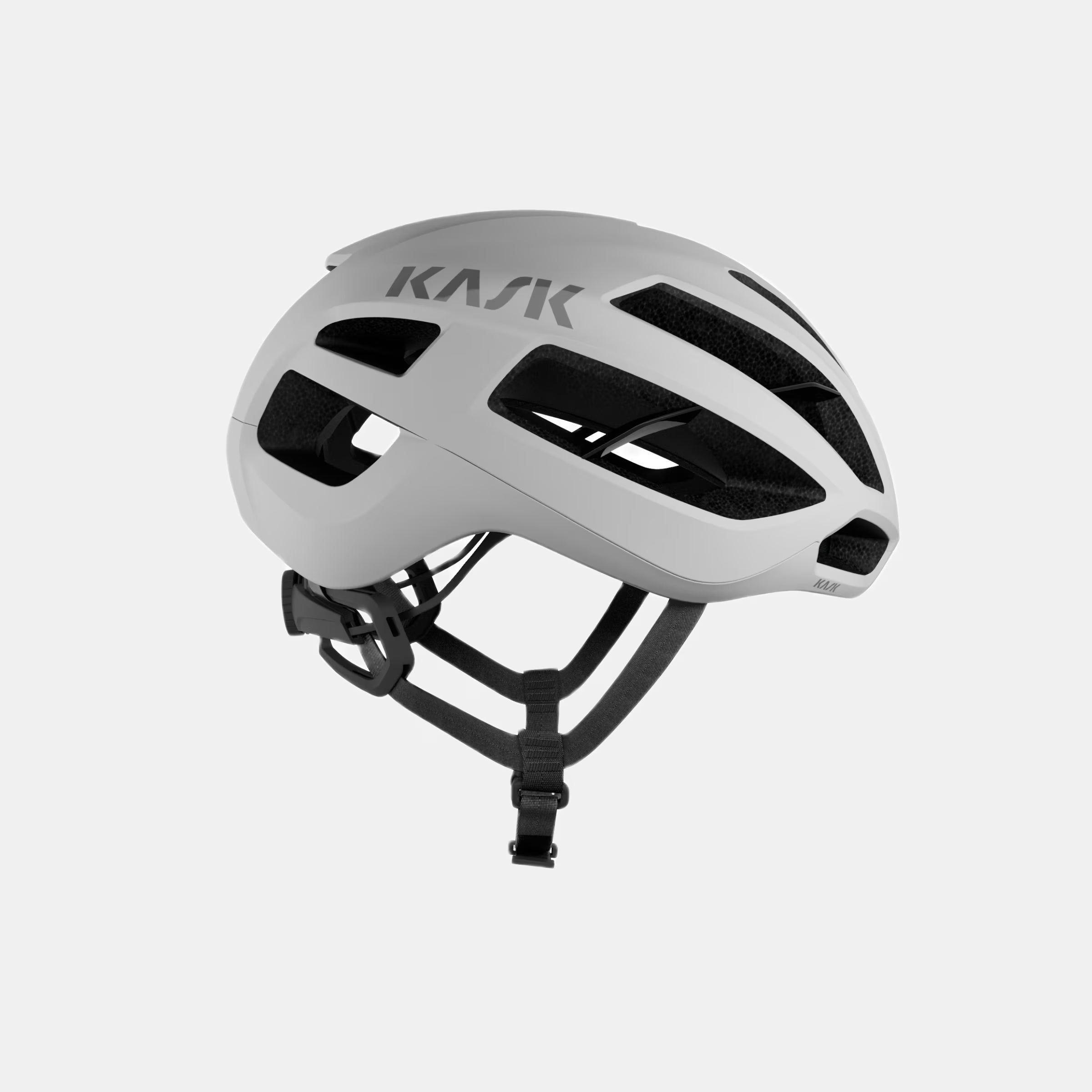 Kask Protone Icon Helmet - White Matt side view showing aerodynamic vents and adjustable chin strap for cycling safety and comfort