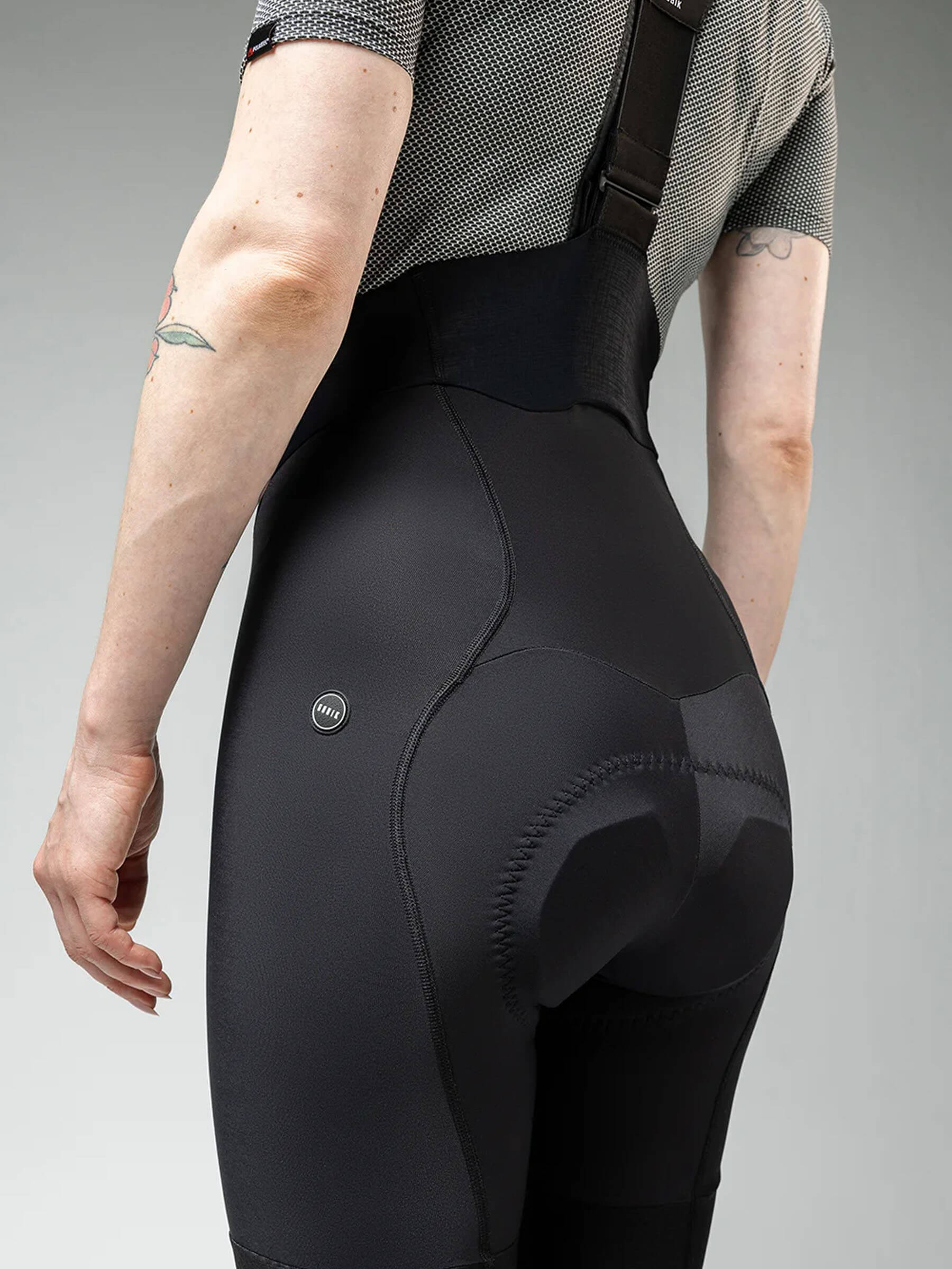 Back view of a woman wearing GOBIK Absolute 6.0 K9 Bib Tights - Women's showing padded seat and ergonomic fit details